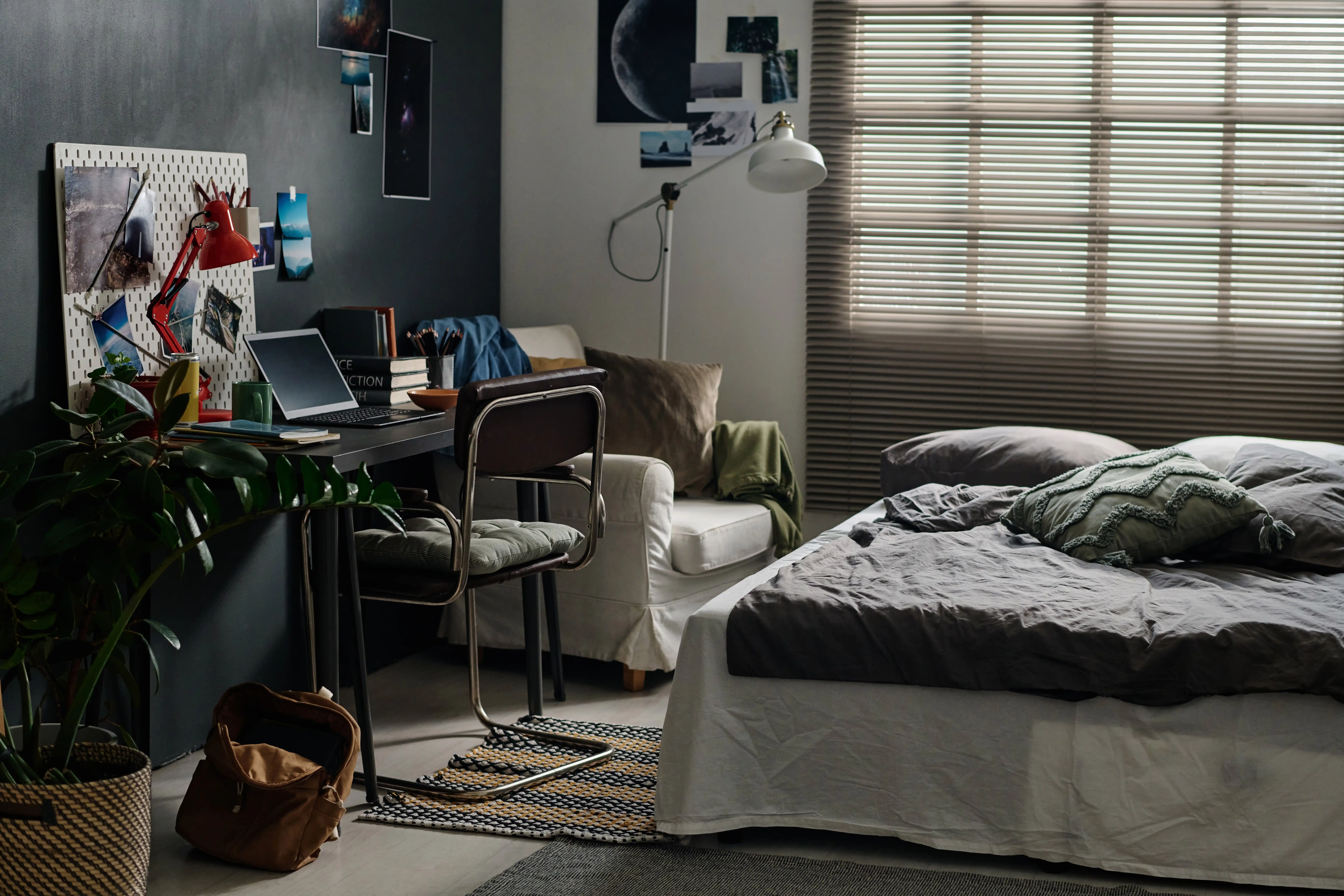 double-bed-with-grey-cushions-and-blanket-standing